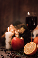 Christmas composition coffee beans, orange, wine, candle. New Year's table