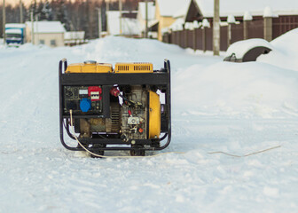 natural light. shallow depth of field. snow. an autonomous generator for generating electricity....