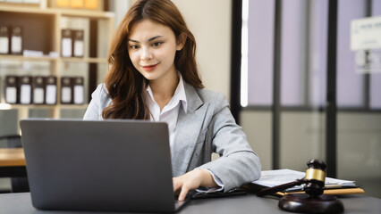 Lawyer business woman working with paperwork on his desk in office workplace for consultant lawyer in office.