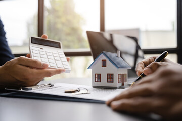 Fototapeta premium Home Insurance and Real estate investment concept, new client after signing agreement contract with approved property application form.