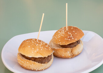 Close-up photo of a typical tapa from a Spanish bar, two burgers.