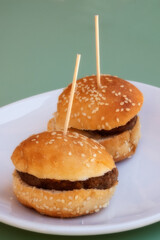 Close-up photo of a typical tapa from a Spanish bar, two burgers.