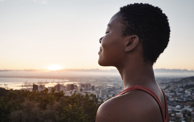 Fitness, breathing or zen black woman in meditation in nature thinking of wellness goals, vision or target. Healthy, spiritual or peaceful happy African girl smiles or relaxing to meditate at sunset - obrazy, fototapety, plakaty