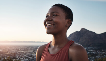 Mountains, fitness and black woman smile for training success, wellness goals and outdoor achievement on blue sky mockup. Morning runner, sports or athlete in nature with cityscape for mental health