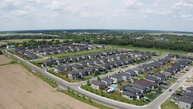 Embrun is a growing town and new businesses and homes are being built. Embrun is one of the fastest growing towns in Eastern Ontario, Canada. Aerial view from drone backing.
