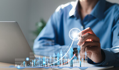 Businessman analyzing sales data graph growth on strategy modern interface icons. Digital online...