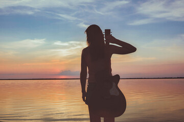 Joyful feeling satisfaction traveller, woman alone with acoustic guitar in summer time vacation leisure. pretty lady lifestyle. - obrazy, fototapety, plakaty