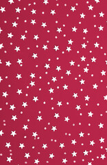 Christmas pattern made of silver stars on pink background. Winter concept. 