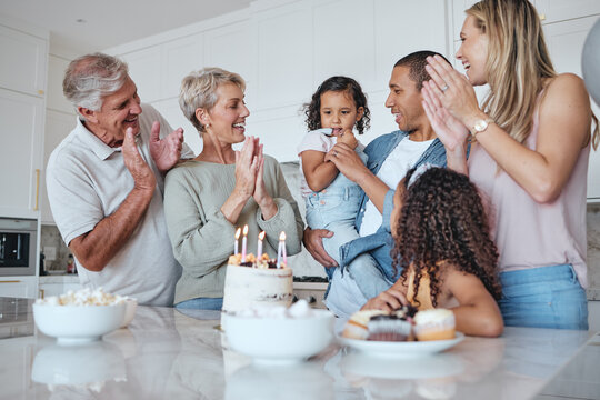 Family, birthday and cake with singing and celebration, party and generations with happiness at family home. Parents, grandparents and children celebrate with dessert, fun and love together with care