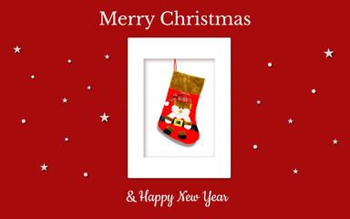 Christmas card with a red gift sock and Santa in a red checkered hat on a red backdrop. The sock is in the white frame. There are also white stars,  snowflakes and christmas inscriptions. JPG file.
