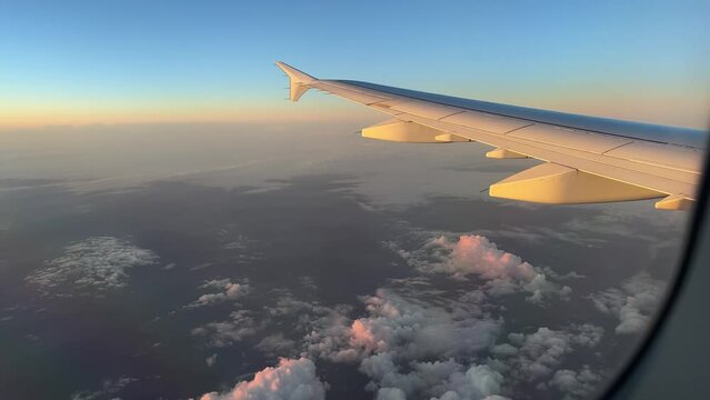 View from airplane window in golden hour