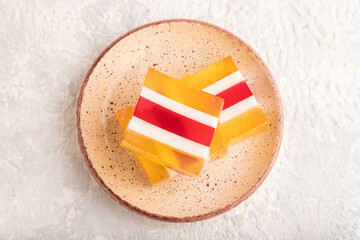 Almond milk and peach jelly on gray concrete. top view, close up.