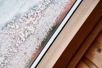 Closeup of a frozen window indoors in winter
