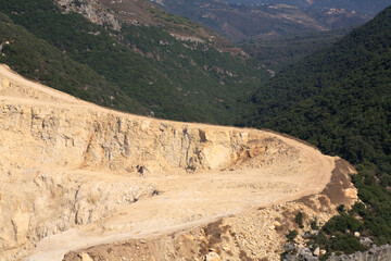 A road used by trucks to haul raw materials from a cement quarry.