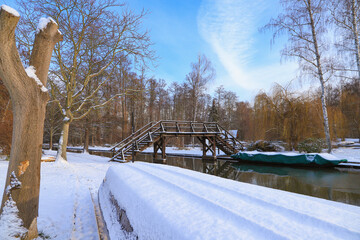 View to a snowy wooden bridge in Lübbenau (Spree Forest) in winter, Germany