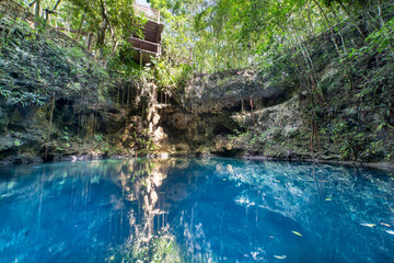 Cenote cave lake, Chichen Itza, Mexico. Cenote Zapote. Natural sinkhole pond with crystal clear water.