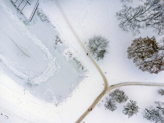 Aerial view. Winter landscape, snow, frost, white everywhere. Path, trees , white powder.