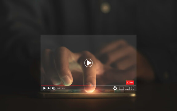 Man touching smartphone to watching and live streaming window for Video streaming on internet and multimedia technology concept.