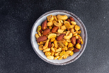 nut mix almond, cashew, pistachio, peanut fresh nuts meal food snack on the table copy space food background rustic top view