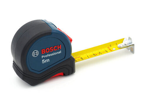 ROME, ITALY - DECEMBER 20, 2022. Bosch Professional 5m measuring tape isolated on white background. Bosch is a German multinational engineering and technology company.