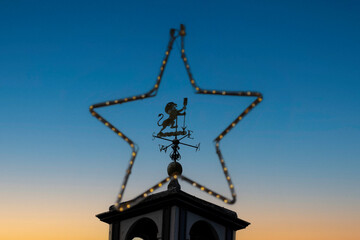 View of weather vane through star illumination at Tatton Park