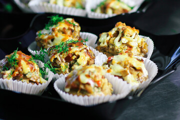 close up.meat muffins in the forms on the table in the restauran