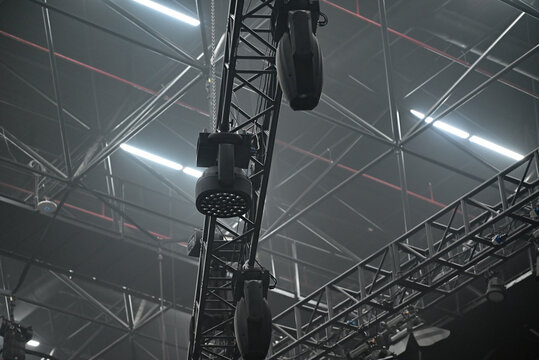 Moving head light LED wash on black truss. Concert light on truss. Light equipment