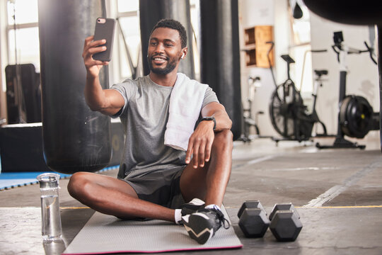 Selfie, black man and gym for exercise, training and workout for social media, connectivity and relax. African American male, athlete and smartphone to share pictures, fitness and wellness with smile