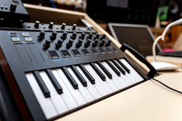 Close-u? of modern synthesizer, midi keyboard. Professional musical instrument for recording studio