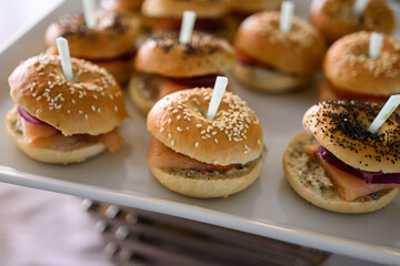 Close-up of appetizer snacks mini burgers on a white plate
