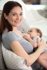 Fototapeta na wymiar portrait of woman breastfeeding her child