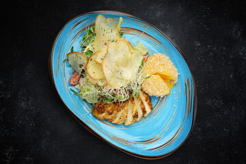 Baked meat with salad and poached egg