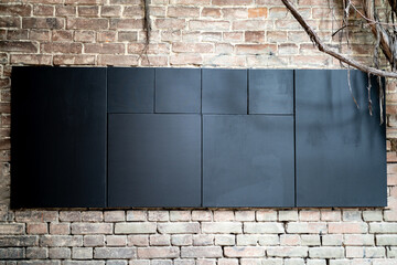 Black board on a brick wall copy space