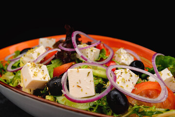 Greek salad with cheese, vegetables and olives
