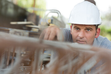 a builder checking steel frame