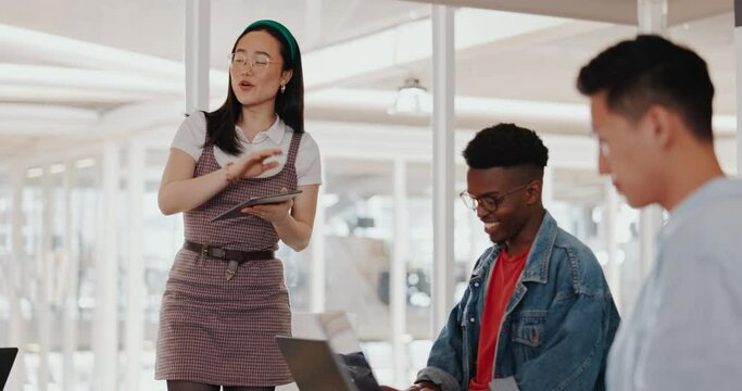 Asian business woman, tablet or mentor in digital marketing company, advertising coworking space or branding education. Creative designer, speaker or team work meeting diversity with kpi technology