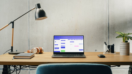 Laptop Computer with Software Platform Screen Display Standing on a Desk. Efficiently Minimalistic Design of Modern Office Space. Business, Scheduling, Website for Time Management and Planning