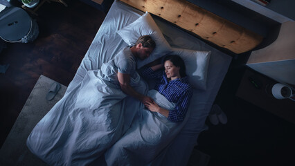 Top View Apartment: Happy Young Couple Sleeping in Bed at Night. Beautiful Girlfriend and Handsome...