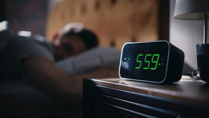 Handsome Man Wakes Up and Turns off Alarm Clock. Proceeds to Have a Productive Day of Work. Stylish...