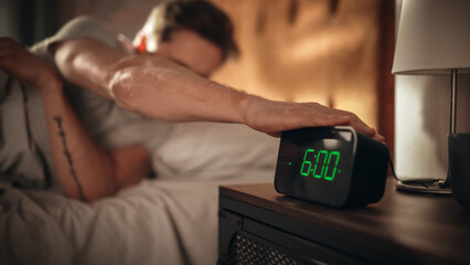 Man Wakes Up and Turns off Alarm Clock. Early Rising Productive Man Ready Start a Day full of New...