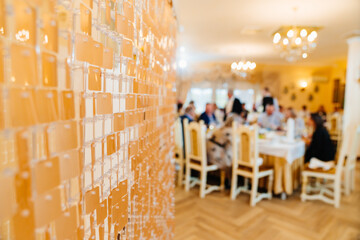 golden decorative panel with sequins in the background of the restaurant 