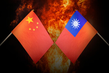 Flags of china and taiwan against background of a fiery explosion. The concept of enmity and war...
