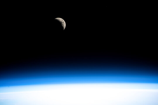 A waxing crescent Moon as seen from the international space station. Digitally enhanced. Elements of this image furnished by NASA.   - Powered by Adobe