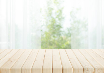 Naklejka na ściany i meble Selective focus.Empty of wood table top on blur of curtain with window and green from garden background.