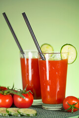Tomato juice from fresh tomatoes with cucumbers. Healthy food. Vegetarian drink.