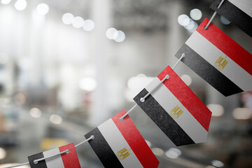 A garland of Egypt national flags on an abstract blurred background