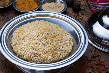 Mandi rice, plain biryani, or sada pulao served in dish isolated on table top view of arabic food