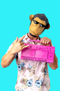 Anonymous male in pixel monkey mask with vintage boombox showing horn gesture