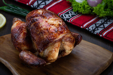 Rotisserie Chicken or grilled served in wooden board isolated on table top view of arabic food