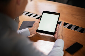 Close up of man using digital tablet.